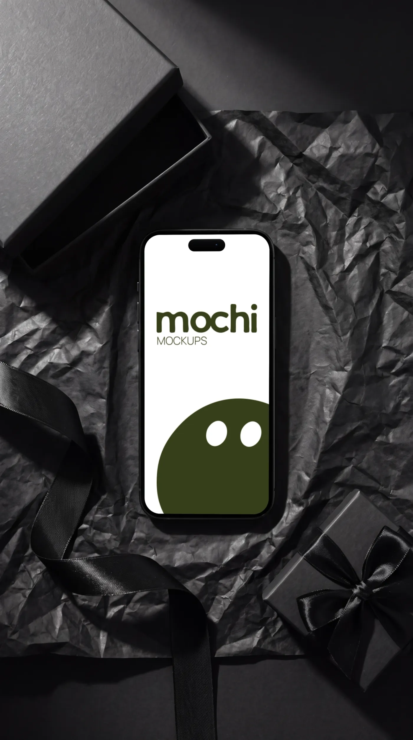 Phone mockup on a surface, studio scene — Black Crinkled Paper Gift Flatlay