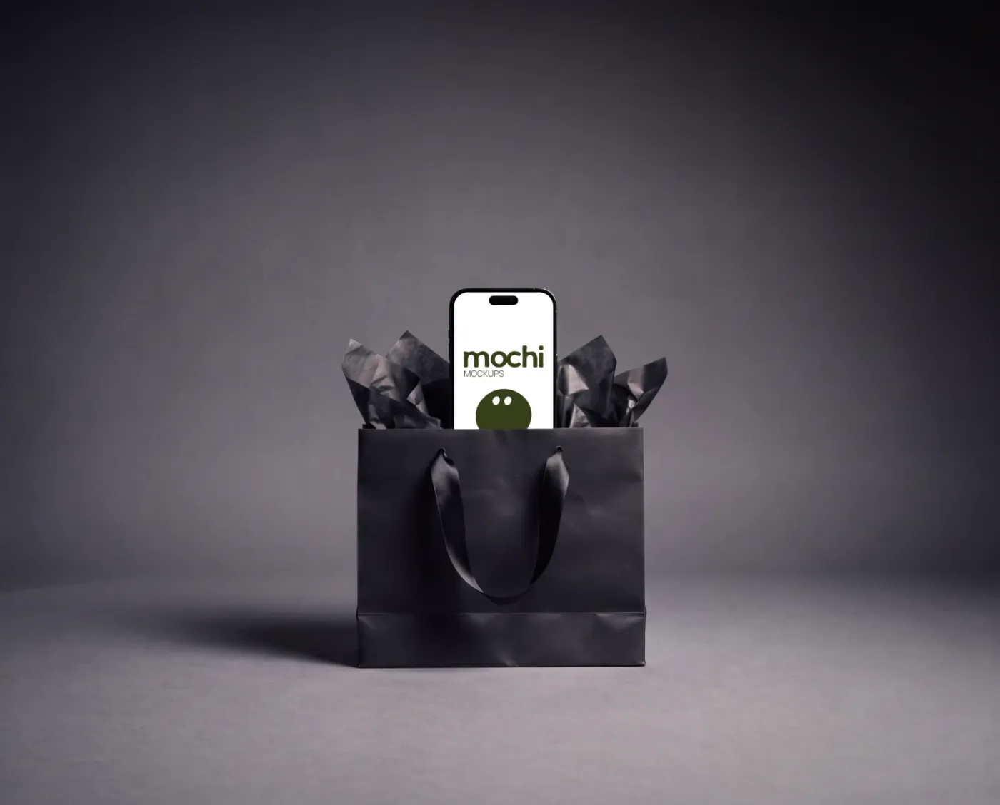 Phone mockup on a surface, studio scene — Black Gift Bag Phone Standing