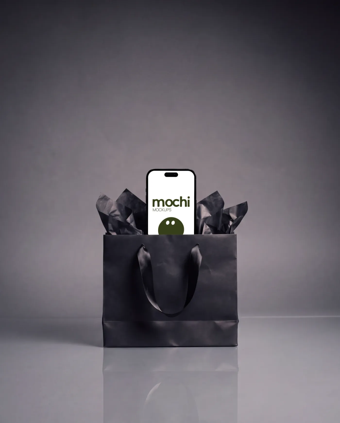 Phone mockup on a surface, studio scene — Black Gift Bag Tissue Display