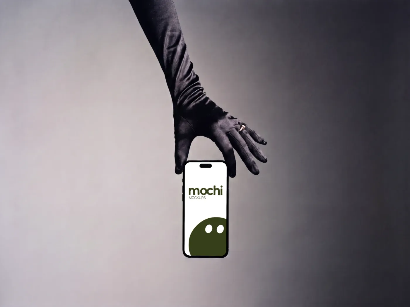 Phone mockup held in hand, studio scene — Black Satin Glove Studio Handheld